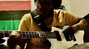 Jamilah Bourdon: Blogger, Multi-Instrumentalist and Revolutionary woman plays electric guitar